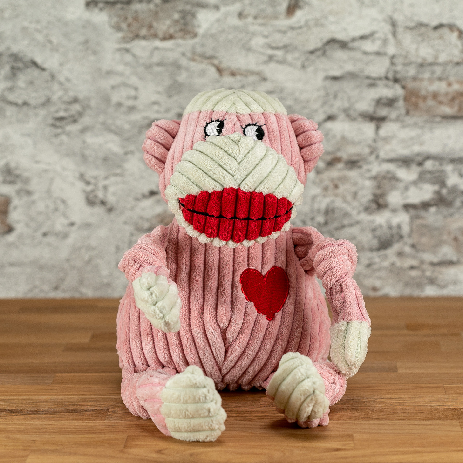 pink monkey dog toy